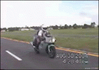 Chick_falls_off_motorcycle.gif