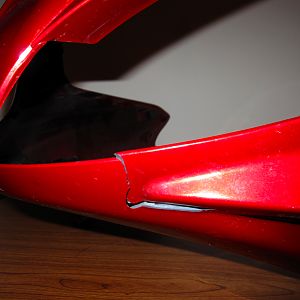 crack on fairing right side (under headlight)