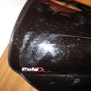 Scratched PUIG dark smoke windscreen (close-up)