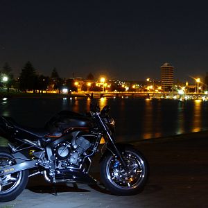 DAMIEN AT THE BAY, AT NIGHT.