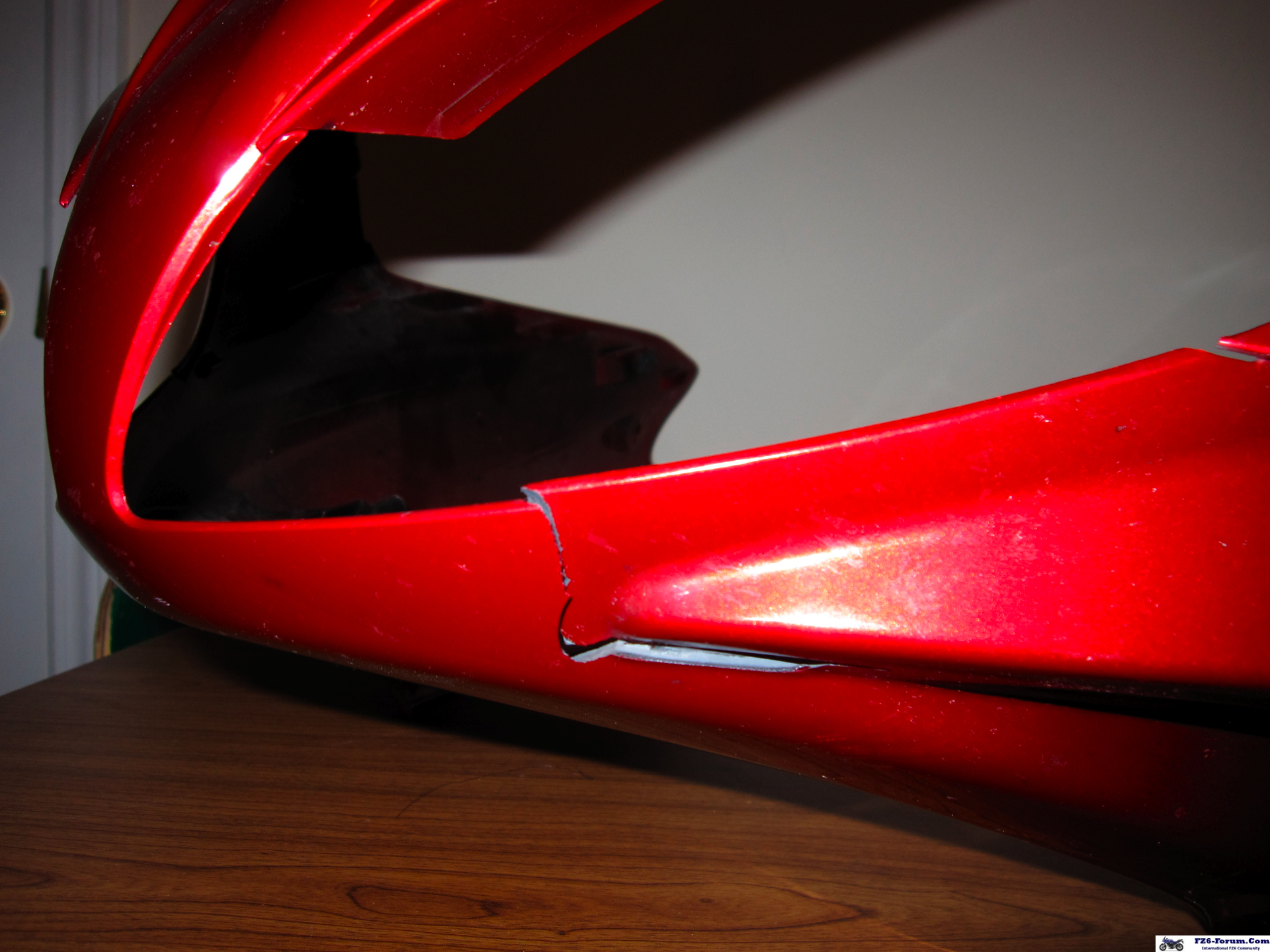 crack on fairing right side (under headlight)