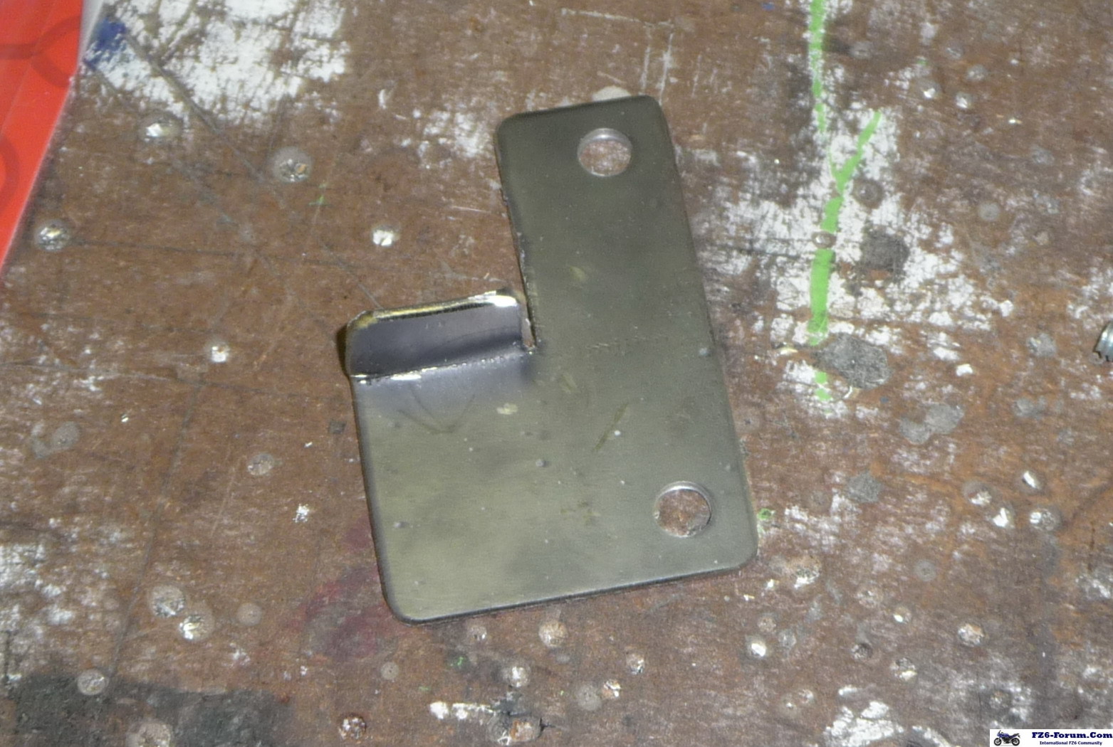 New exhaust clamp mount bracket.