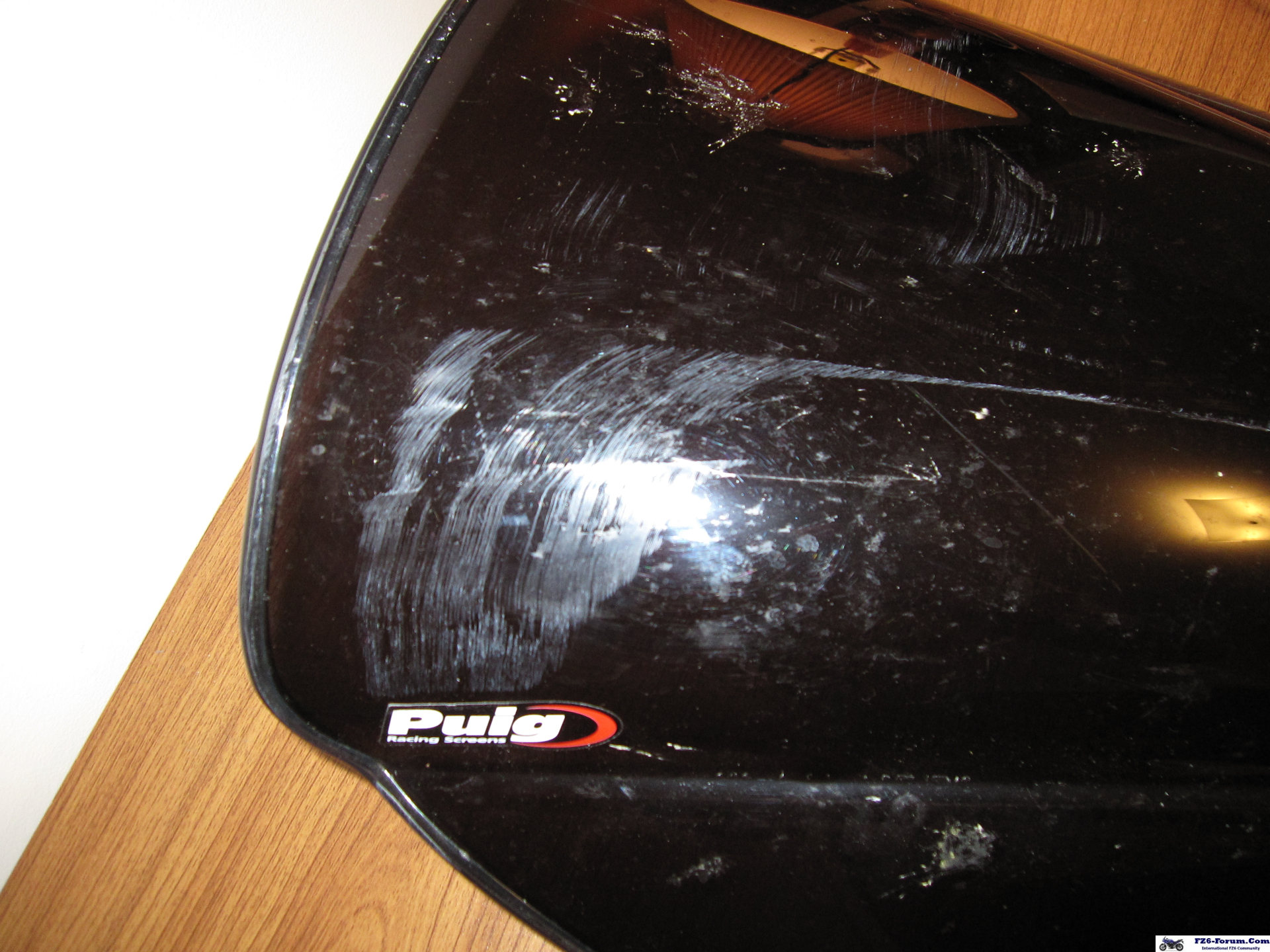 Scratched PUIG dark smoke windscreen (close-up)